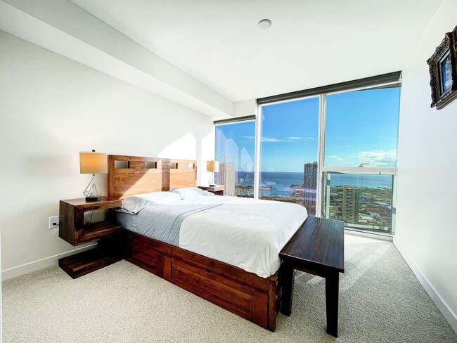 Building Photo - Furnished Symphony Condo with Direct Ocean Views and Two Parking
