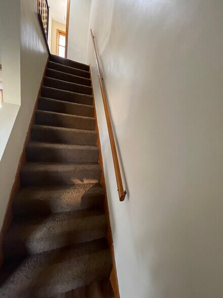 Stairs to upstairs - 8451 Pleasantwood Ave NW