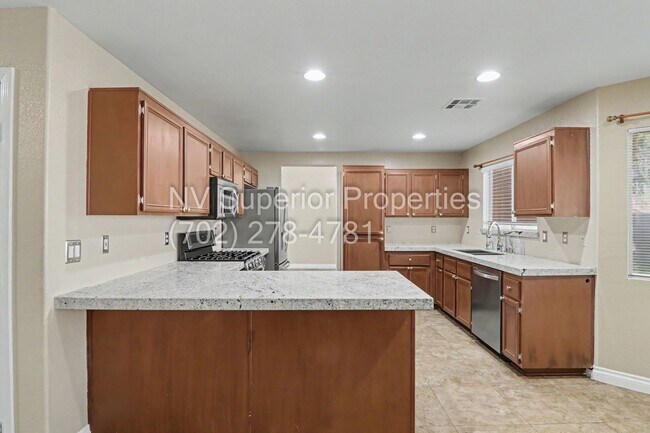 Building Photo - NW!! 4 bedrooms!! Bed & Bath DownStairs!!! RV Parking!!! Synthetic Grass Front yard!! Real Grass ...