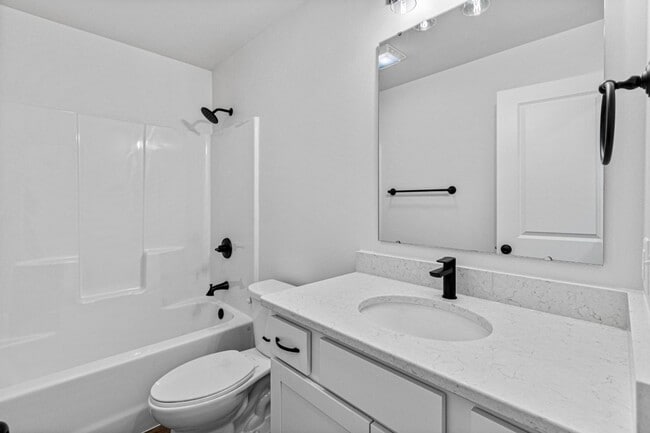 Building Photo - New 3 Bed Townhome with Covered Deck and Oversized Garage!