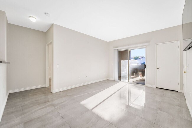 Building Photo - Modern Gated Condo with Upgraded Interior and Attached Garage in Prime South Las Vegas Location!
