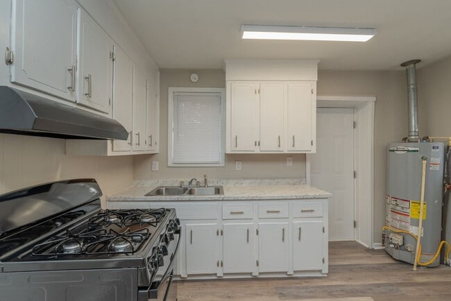Building Photo - Brick home with a fenced-in yard! Section ...