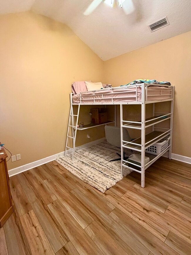 Building Photo - 3/2 with grass cutting included & access to community amenities.