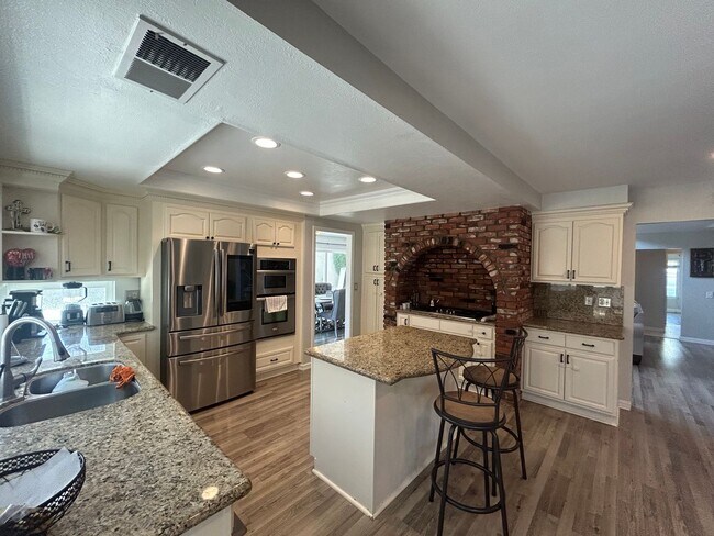 Building Photo - Upgraded 4-Bedroom Home in Gated Green Riv...