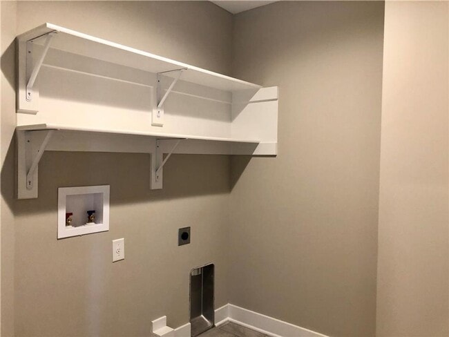 Building Photo - COMING SOON: Modern 3-Bedroom Townhome wit...