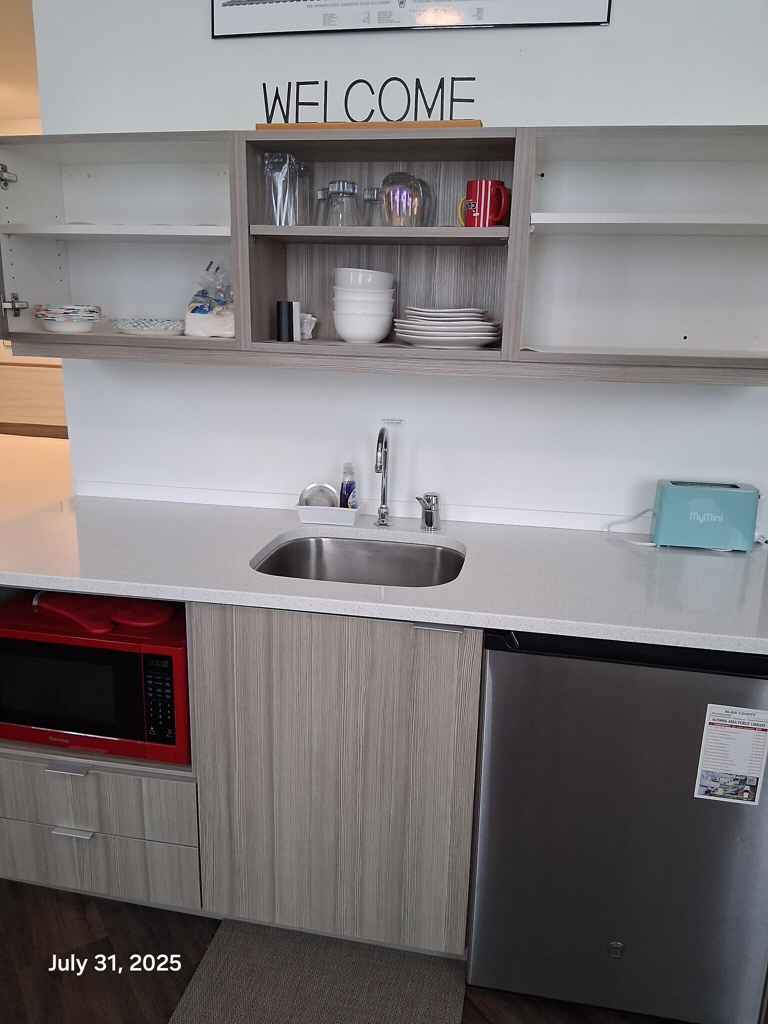 Kitchenette with microwave oven and undercounter refrigerator - 818 12th St