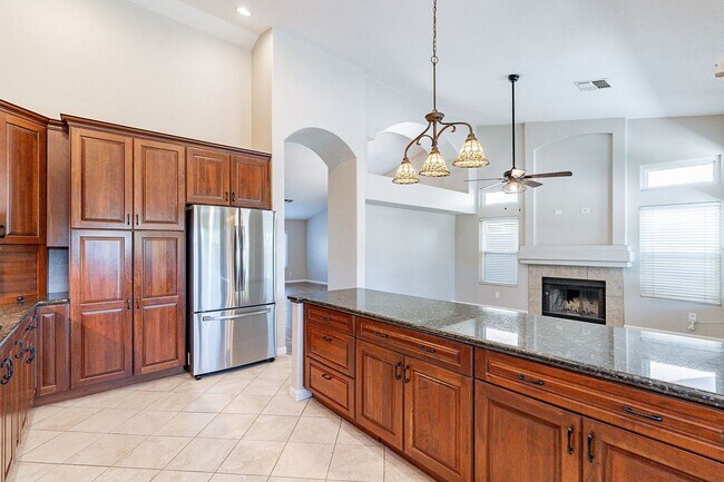 Building Photo - Charming 4-Bedroom Home with Luxurious Poo...