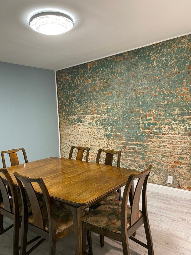 Original brick wall in dining room - 5920 Kellogg Ave