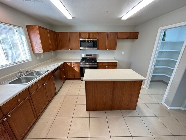 Building Photo - Spacious Tri-Level 4-Bedroom Home with Bal...