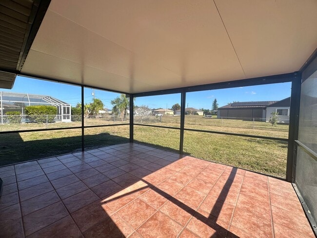 Building Photo - Fenced 3/2 with Screened Lanai in NE Cape Coral