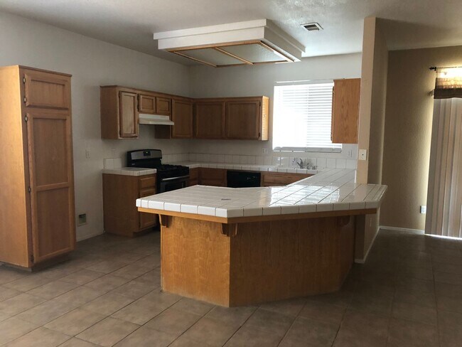 Building Photo - Coming Soon: Spacious 3 Bedroom, 2 Bath Tevis Ranch Home with Fireplace, Covered Patio & 2-Car Ga...