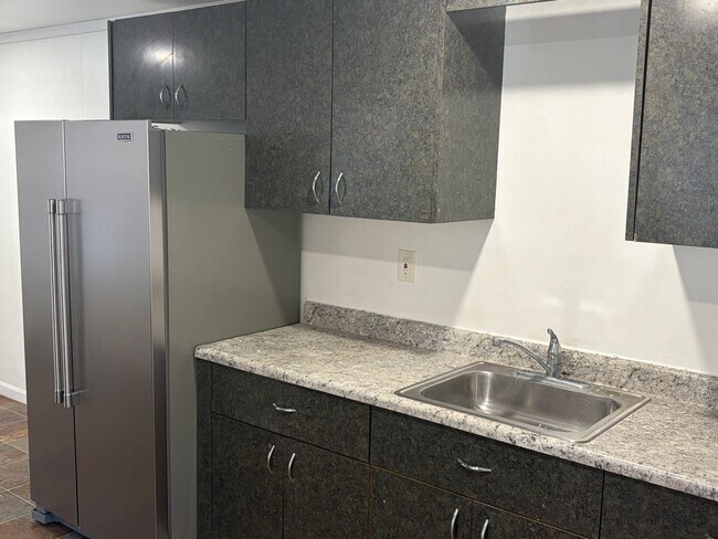 Building Photo - Charming 3 Story Brick Townhome Now Available