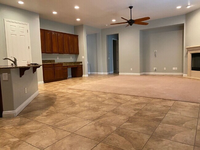 Building Photo - 5-Bed Retreat with Granite Elegance & Cozy Fireplace – 3690 Sq Ft of Comfort in Las Vegas with a ...