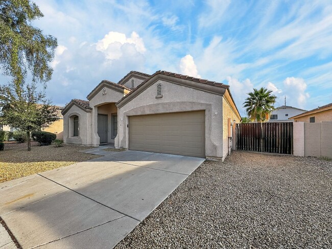 Building Photo - Single-level 4 bed, 2 bath home with tandem 3-car garage and RV gate.