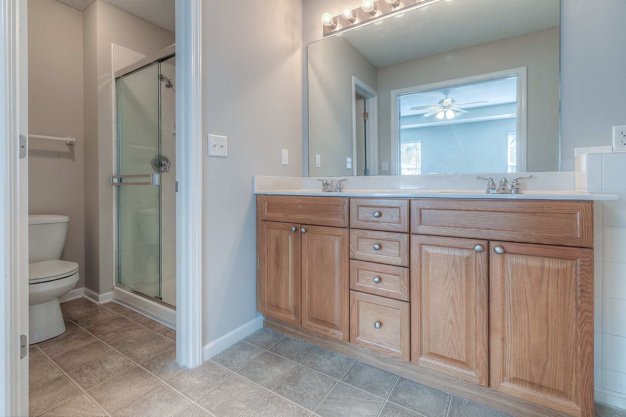 master bath with double vanity, tub and shower - 22810 West 71st Terrace