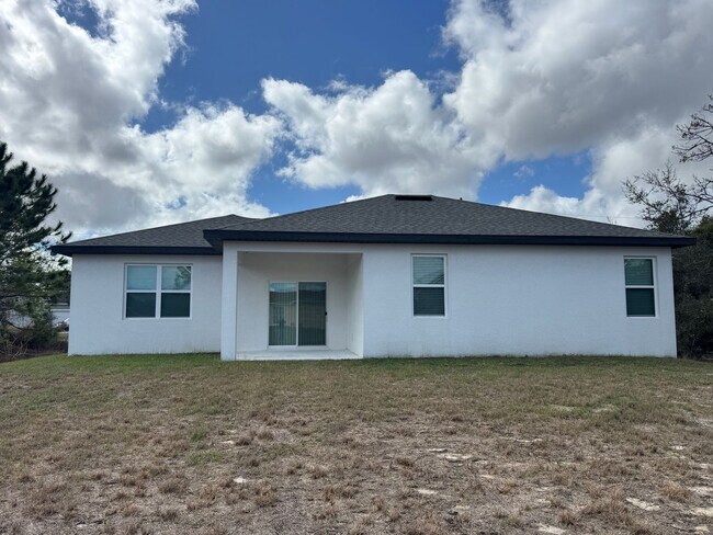 Building Photo - Spacious 4-Bedroom Home in Poinciana – Internet Included & No HOA Approval Required