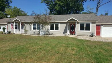 Building Photo - Spacious 3BR Duplex with Finished Basement & 2-Car Garage in Otsego