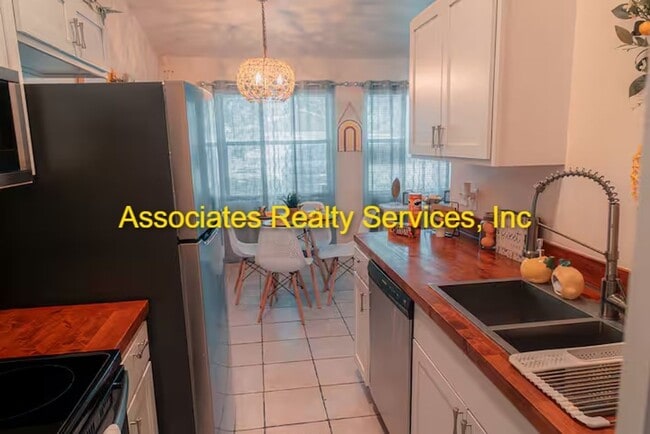 Building Photo - Beautifully furnished  2-Bedroom Duplex – ...