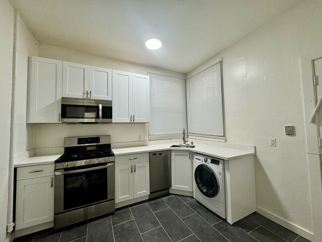 Building Photo - Renovated FLAT w/ laundry in the HEART of ...