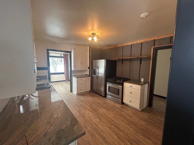 Building Photo - Bigfork Rodeo Farmhouse~ Fenced garden, greenhouse, garage, barn and shop!