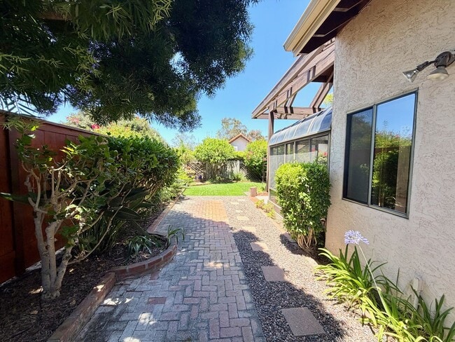 Building Photo - Private Oasis with Sunroom, Balcony & Lush Landscaping | 4BR Home Near Community Pool & Spa