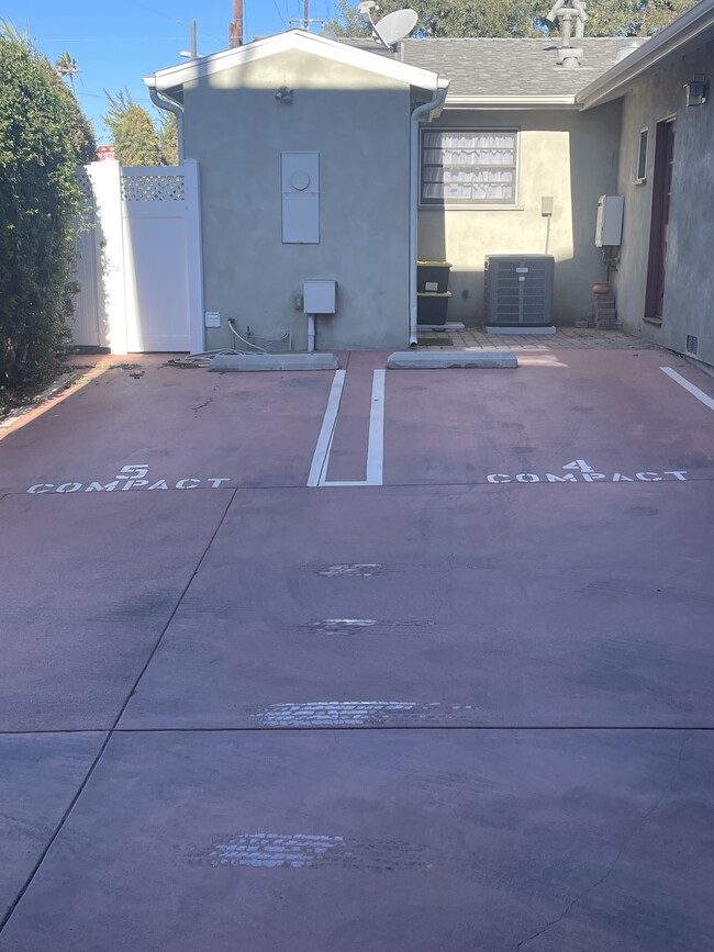 2 parking spaces behind house - 13380 Beach Ave