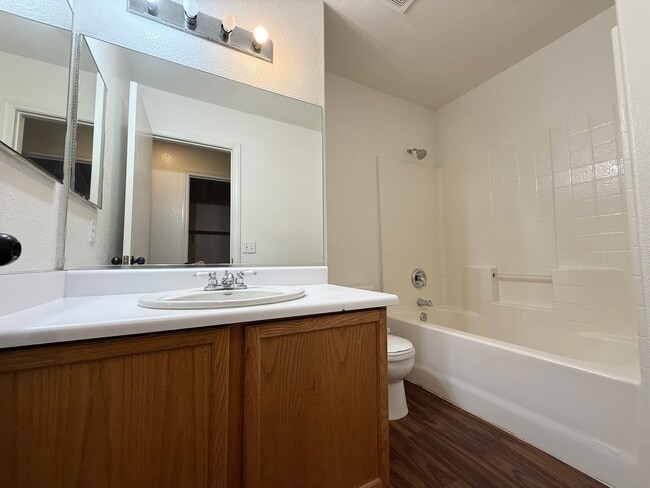 Building Photo - $500 OFF 1ST MONTHS RENT Updated 3-Bedroom Townhome in Gated Community with Pool Access