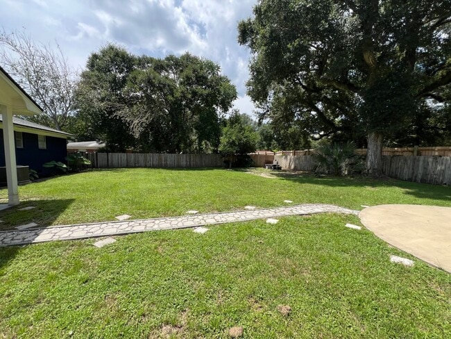 Building Photo - Updated 3BR | Solar Panels + Fenced Yard