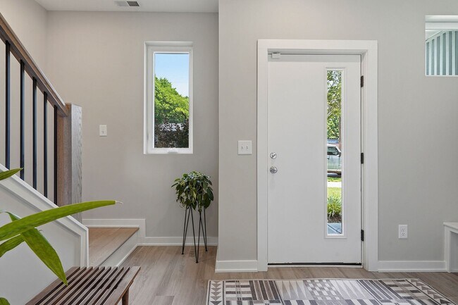 Building Photo - Live Elevated in Downtown Raleigh – Stunning Townhome with Rooftop Oasis!