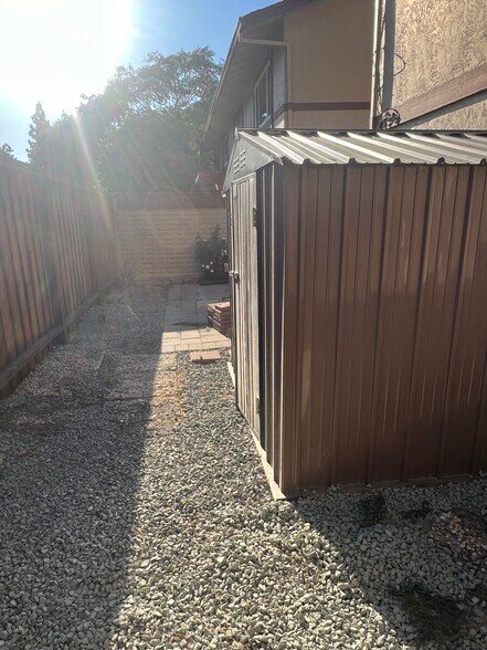 side of patio with storage - 1520 Parkwood Pl