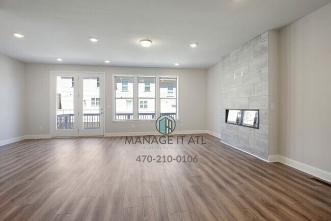 Building Photo - Modern 3-level Townhome featuring 4 bedroo...