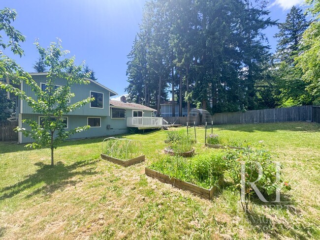 Building Photo - Spacious Poulsbo Home with Large Basement, Fenced Yard & Garden Space