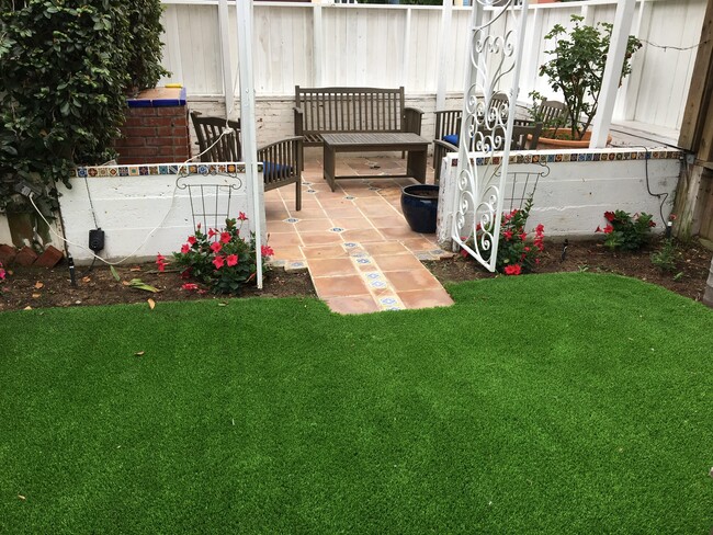 Rear lawn and entry to back patio—fireplace on left - 826 21st St