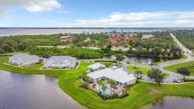 Savor the aerial beauty of Charleston Cay, a haven of lakeside bliss in the heart of Port Charlotte. - Charleston Cay