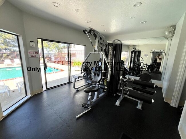 Building Photo - Bright 2BR/2BA Condo with Garage & Pool in...