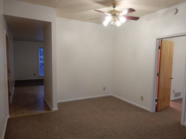 Living room toward kitchen. - 302 Crescent Ct