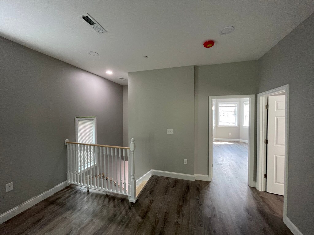 Unit two: (left to right) view of staircase/entry, master bedroom, bedroom one. - 34 Falcon St