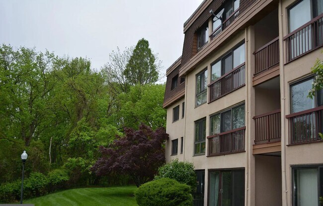 The back of the building facing the pool and the trail - 12730 Veirs Mill Rd
