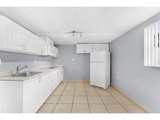 Building Photo - 6049 W 14th Ln