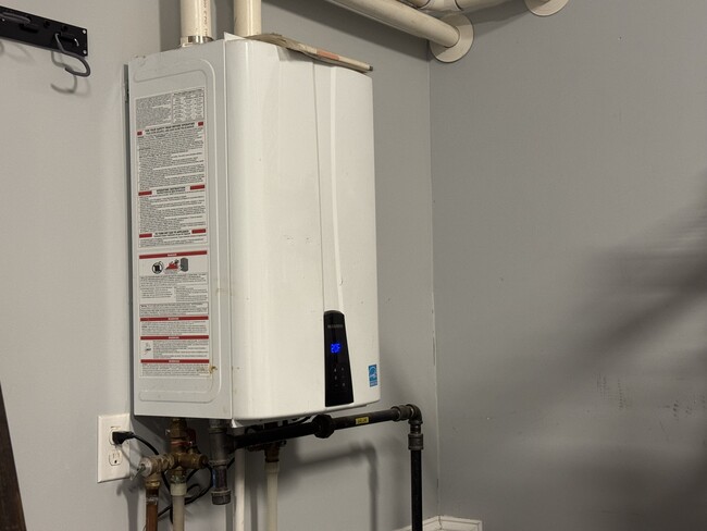 Gas / tankless water heater , almost instant but totally endless hot water. - 9 Allen Ave