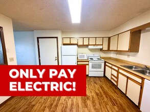 Building Photo - RENT INCLUDES ALL UTILITIES, except for electric! Large 2 bedroom 1 bath apartment in an 8-plex