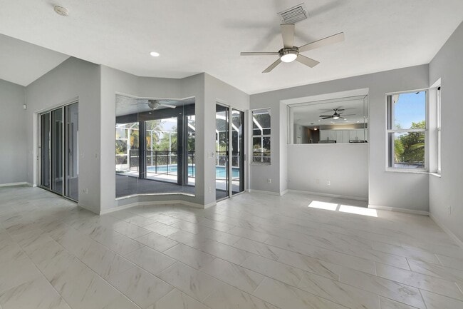 Building Photo - A BOATER'S PARADISE WITH THIS STUNNING 3 BEDROOM, 2 BATH WATERFRONT POOL HOME W/DOCK & BOAT LIFT ...