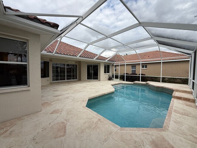 Building Photo - Luxurious 4 Bedroom 3 Bath Lakefront Pool Home W/3-Car Garage