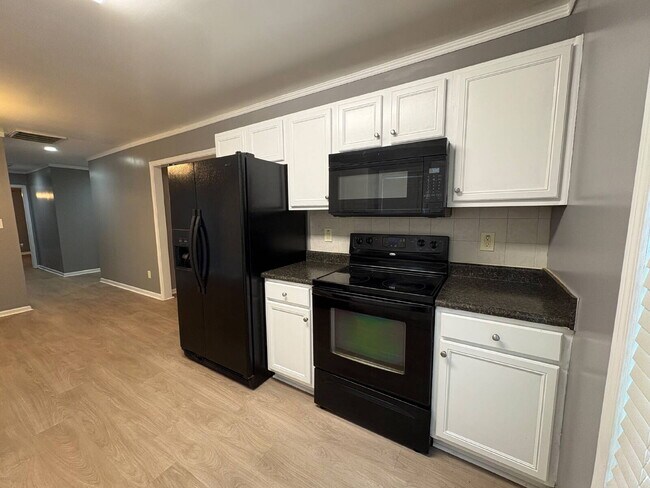 Building Photo - Spacious 4-Bedroom Sanctuary with Cozy Fireplace on Chimney Swift Drive!
