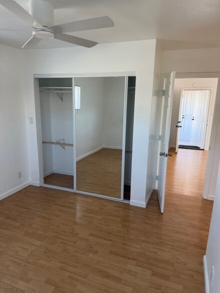 large closet with mirrored sliding doors. - 4626 E 7th St