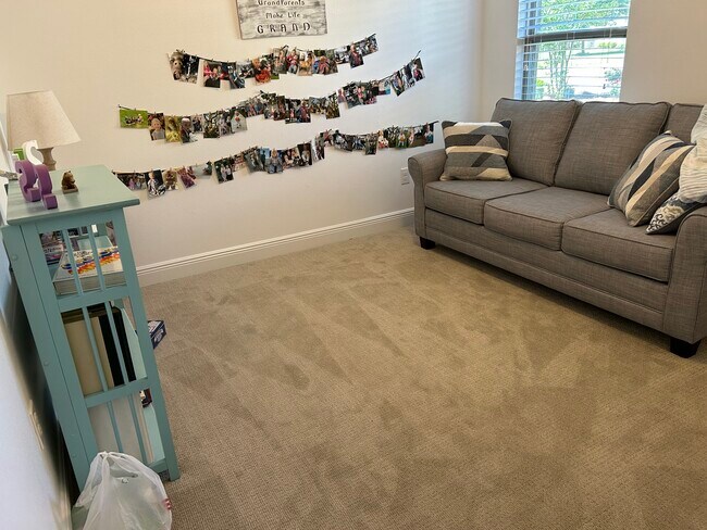 Spare room with sofa couch - 11 Hemingway Ln