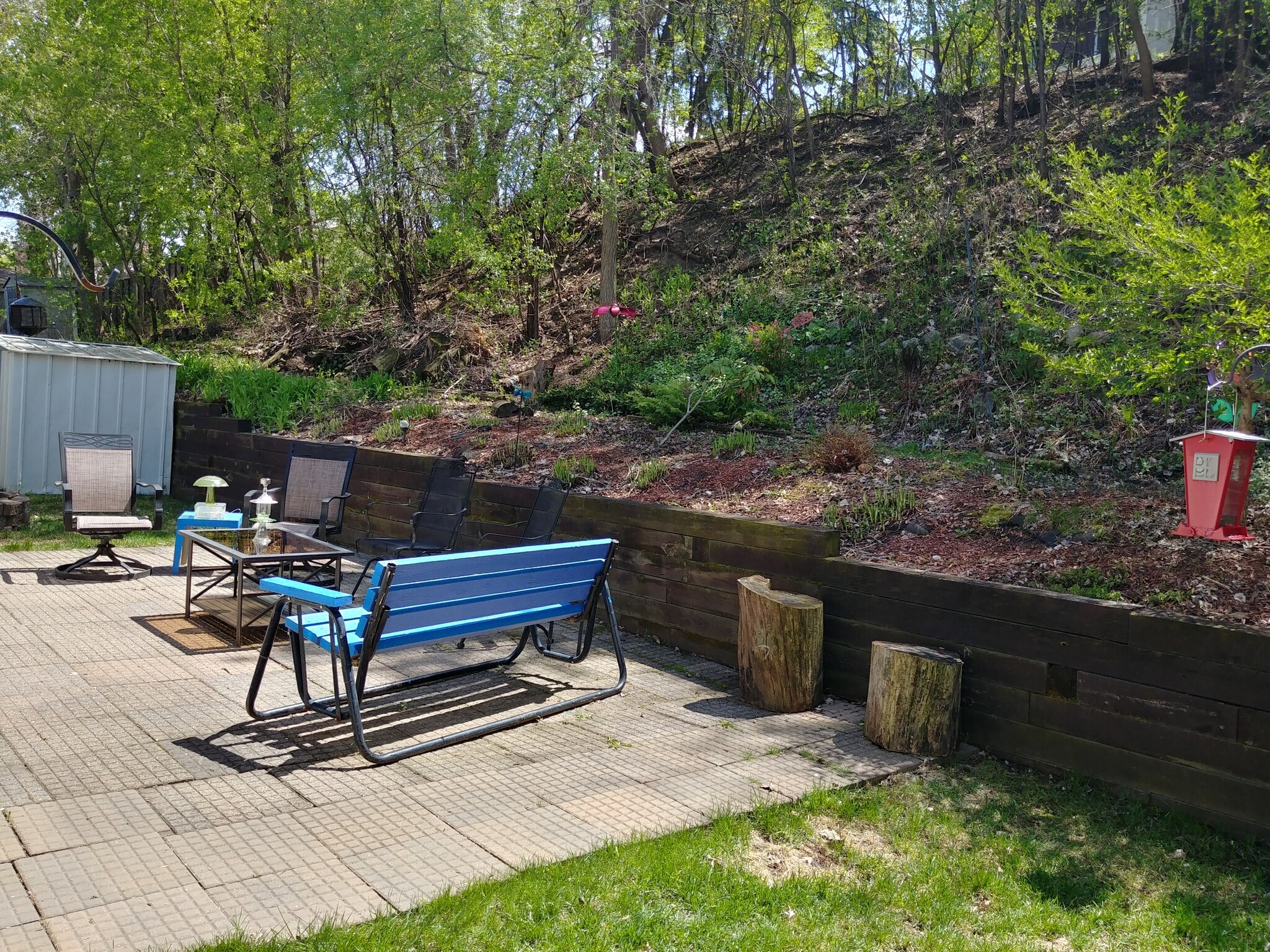Patio view with garden space starting to bloom - 92 Logan Ave W