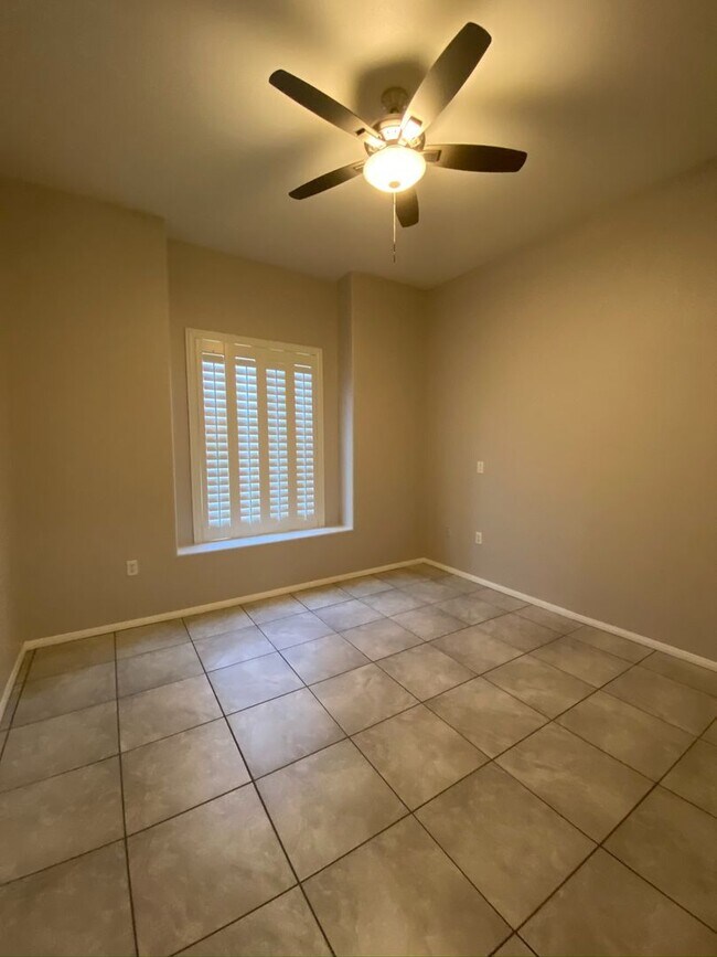 Building Photo - BEAUTIFUL CONDO IN A GATED COMMUNITY FEATURING PLANTATION SHUTTERS, TILE FLOORING AND NEW PAINT T...
