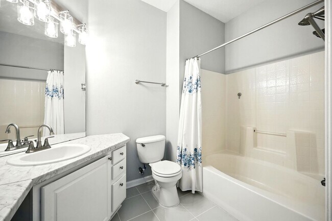 Building Photo - Bright Top-Floor Condo in Resort-Style Gated Community