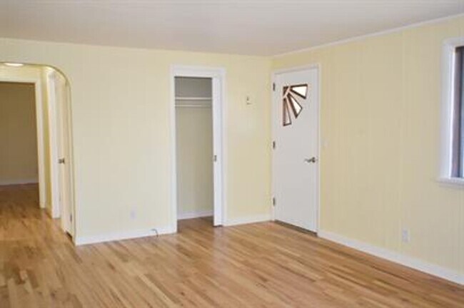 Building Photo - Updated house with original hardwoods and 2-car garage!